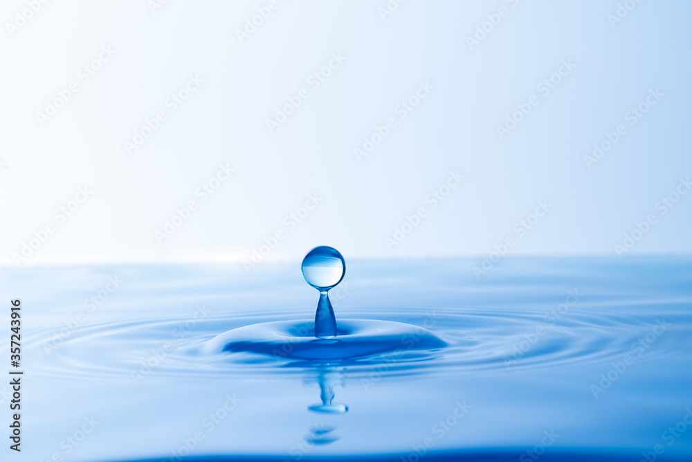 close up water drop splash on surface of water background close up water drop splash on surface of water background