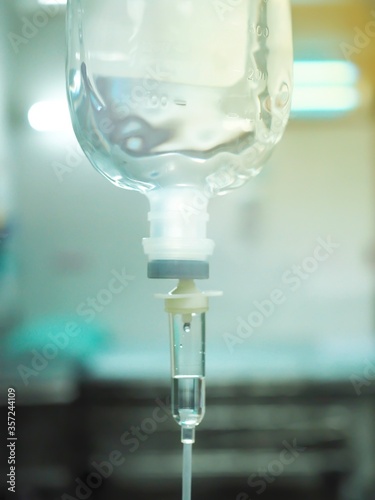Intravenous therapy iv infusion set and bottle on a pole,Set iv fluid intravenous drop saline drip hospital room