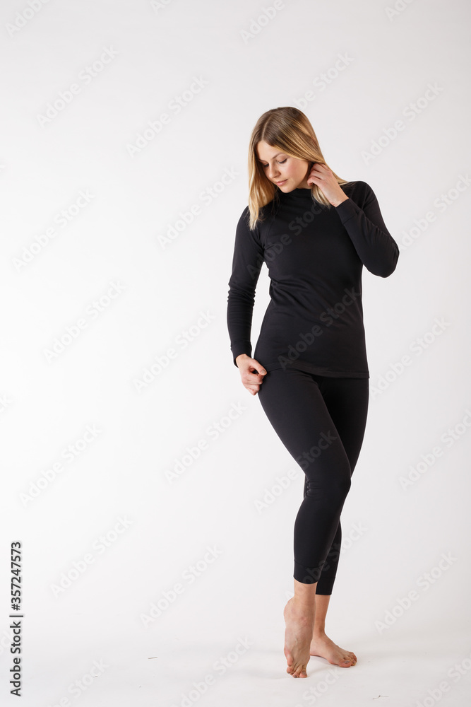 Girl in thermal underwear on a white background. Sportswear. Girl in thermal underwear on a white background. Sportswear.