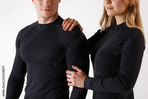 Guy and girl in thermal underwear on a white background