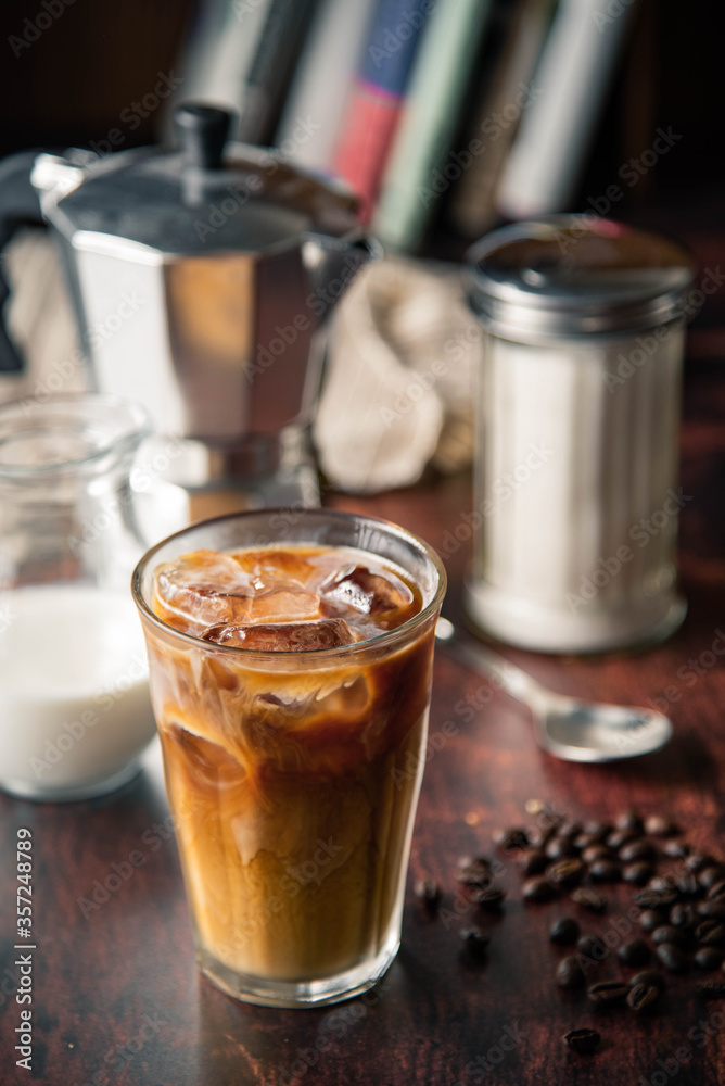 iced coffe with milk and book cafe background iced coffe with milk and book cafe background