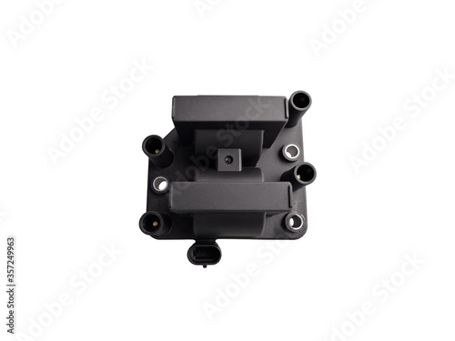 New car ignition coil on an isolated white background. Component of the ignition system. Spare parts.