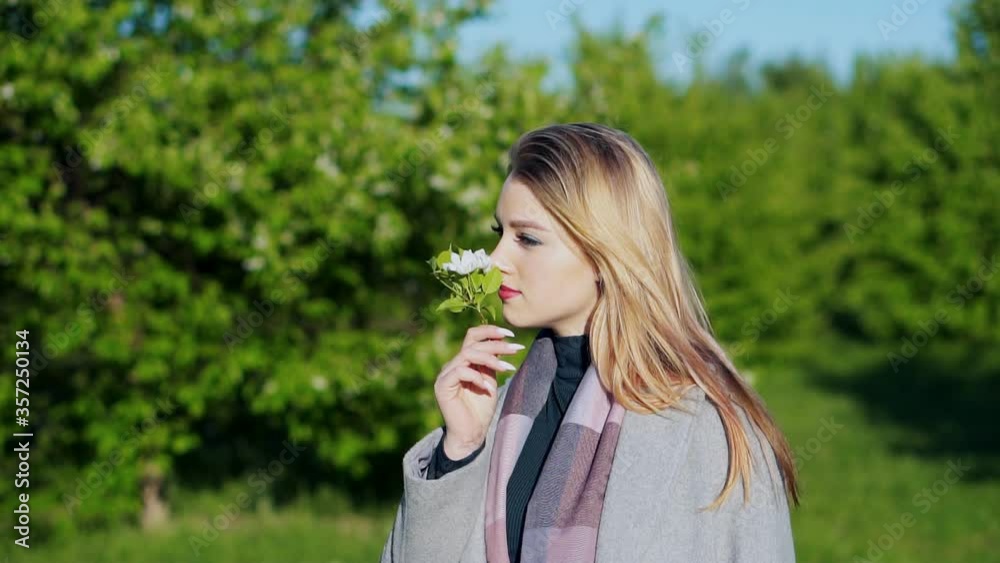 portrait of young lovely woman in spring flowers portrait of young lovely woman in spring flowers