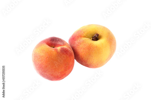 two fresh sweet peaches, isolated