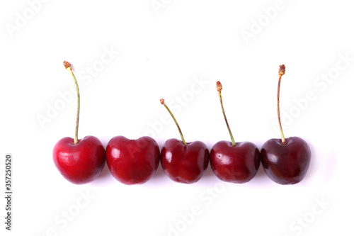 a group of cherries on white