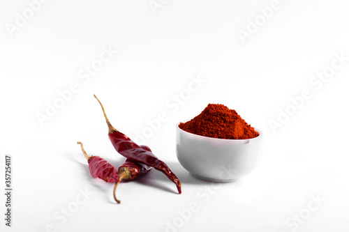 fresh red chilli powder and red chilli isolated stock image. photo