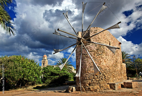 CRETE ISLAND, GREECE. Traditional windmill at Toplou monastery, close to famous Vai beach, Sitia municipality, Lasithi prefecture. photo
