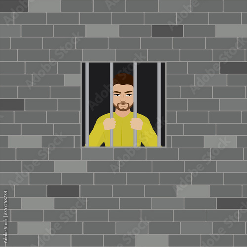 Old brick wall facade and small window, prison. Cartoon male prisoner holds hands behind bars.