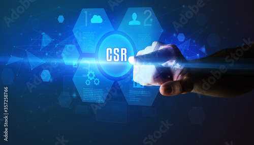 Hand touching CSR inscription, new technology concept