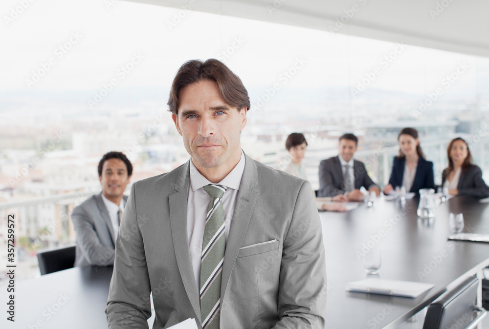 Portrait of confident business people in conference room Portrait of confident business people in conference room