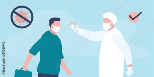 Medical worker checks the body temperature of businessman. Doctor or staff in special uniform and mask. Covid-19 prevention.
