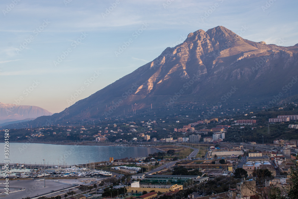 The port of Termini Imerese with the lights of the sunset on the Massif of Termini