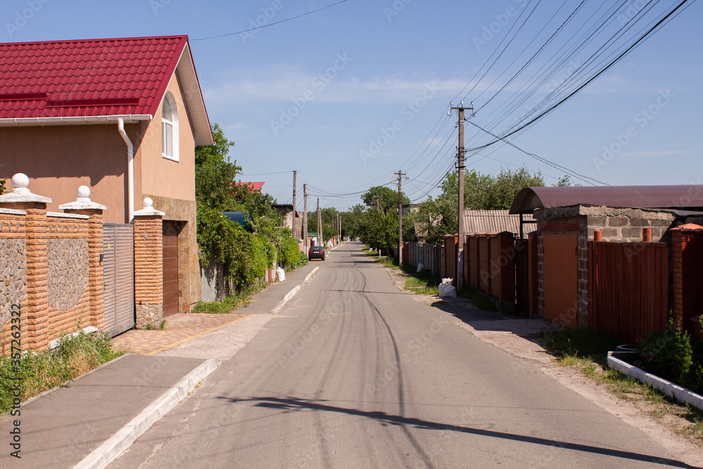 street in the village in summer with a blue sky street in the village in summer with a blue sky