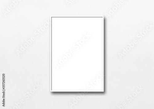 White picture frame hanging on a wall