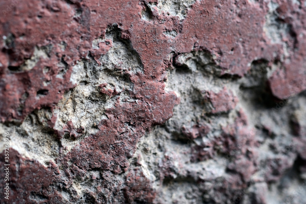 potholes in an old concrete painted wall. potholes in an old concrete painted wall.