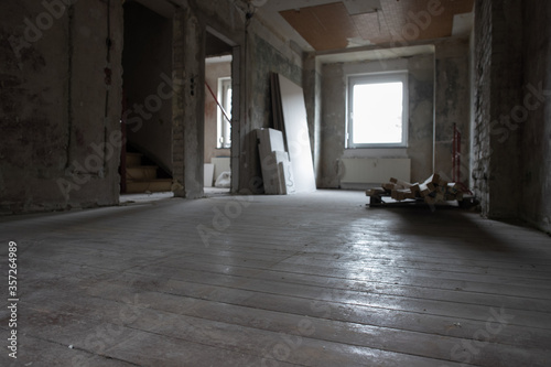 construction site within a residential town house, restoration works on real estate shown from the interior, no people