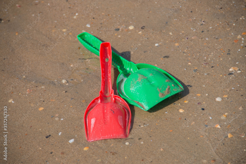 children's toy shovels in the sandbox
children's toy shovels in the sandbox