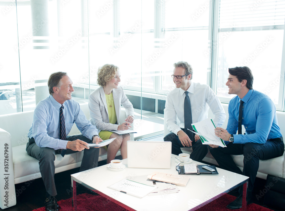 Business people talking in lobby area