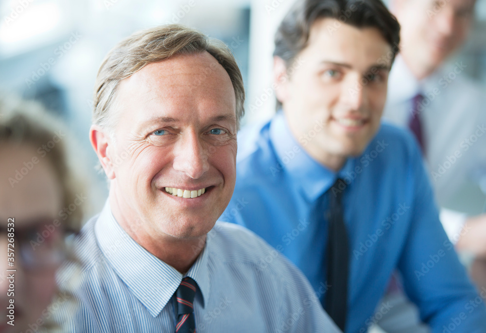 Businessmen smiling in meeting Businessmen smiling in meeting