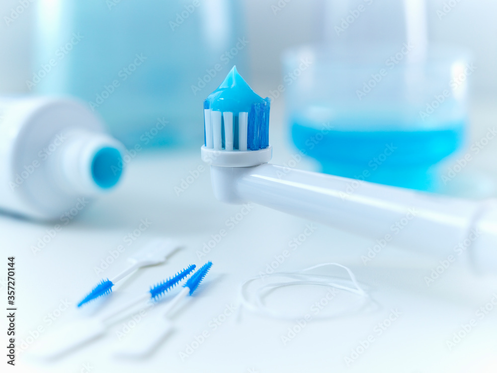 Close up of toothpaste on electric toothbrush Close up of toothpaste on electric toothbrush