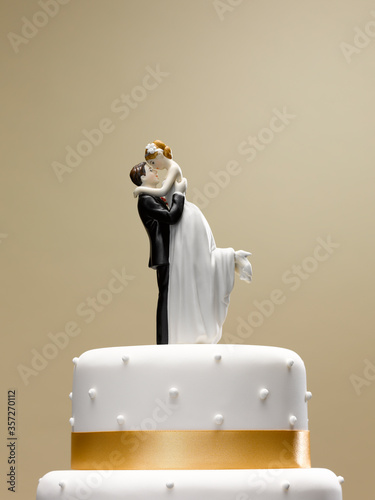 Photography Bride and groom topper on wedding cake