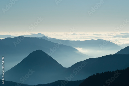 Aerial view of mountaintops over clouds © Deb Casso/KOTO