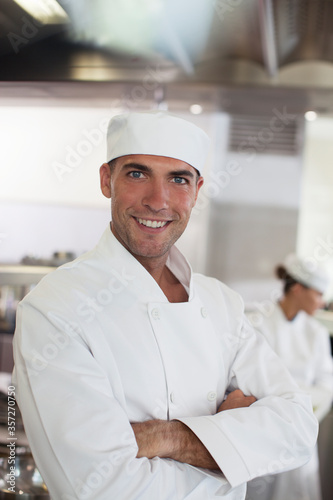 Chef smiling in restaurant kitchen