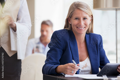 Businesswoman working in restaurant