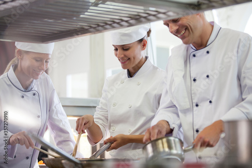 Chefs cooking in restaurant kitchen