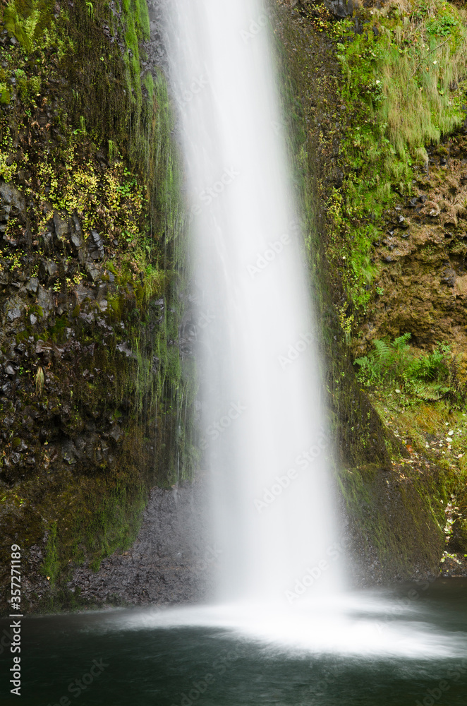 Fototapeta premium Waterfall emptying into still pool