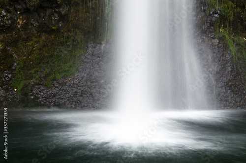 Time lapse view of waterfall emptying into pool