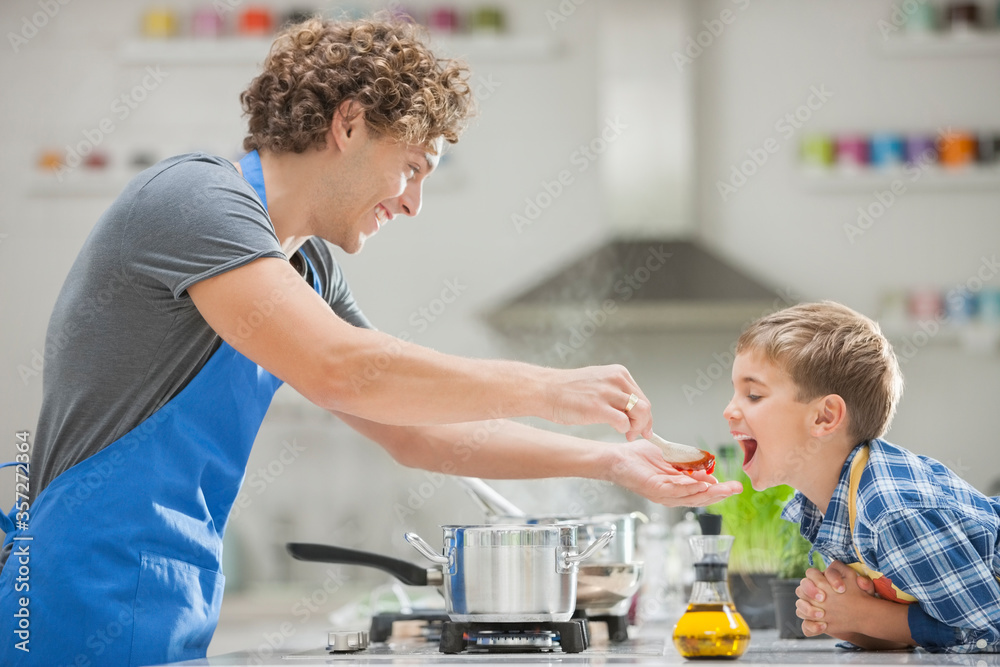 Father and son cooking in kitchen Father and son cooking in kitchen