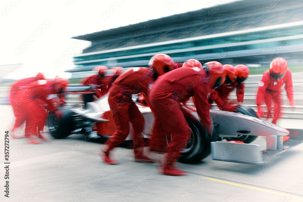 Фотография Racing team working at pit stop