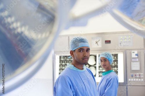 Surgeons standing in operating room