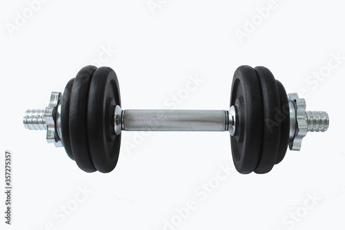 Dumbbells for the gym, weight for training. Black circles with weight and iron and silver skeleton, for exercise, for muscels