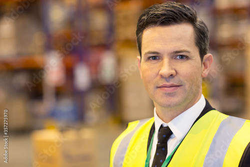 Businessman standing in warehouse