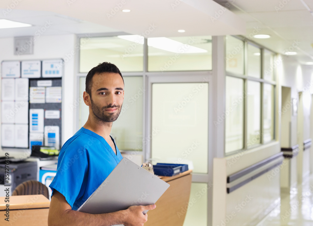 Nurse smiling in hospital hallway