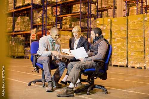 Business people talking in warehouse