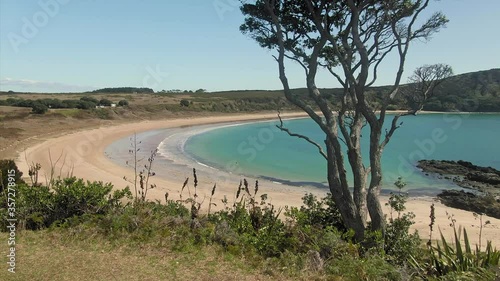 Aerial flying over Maitai Bay on the Karikari Peninsula, Northland, New Zealand photo