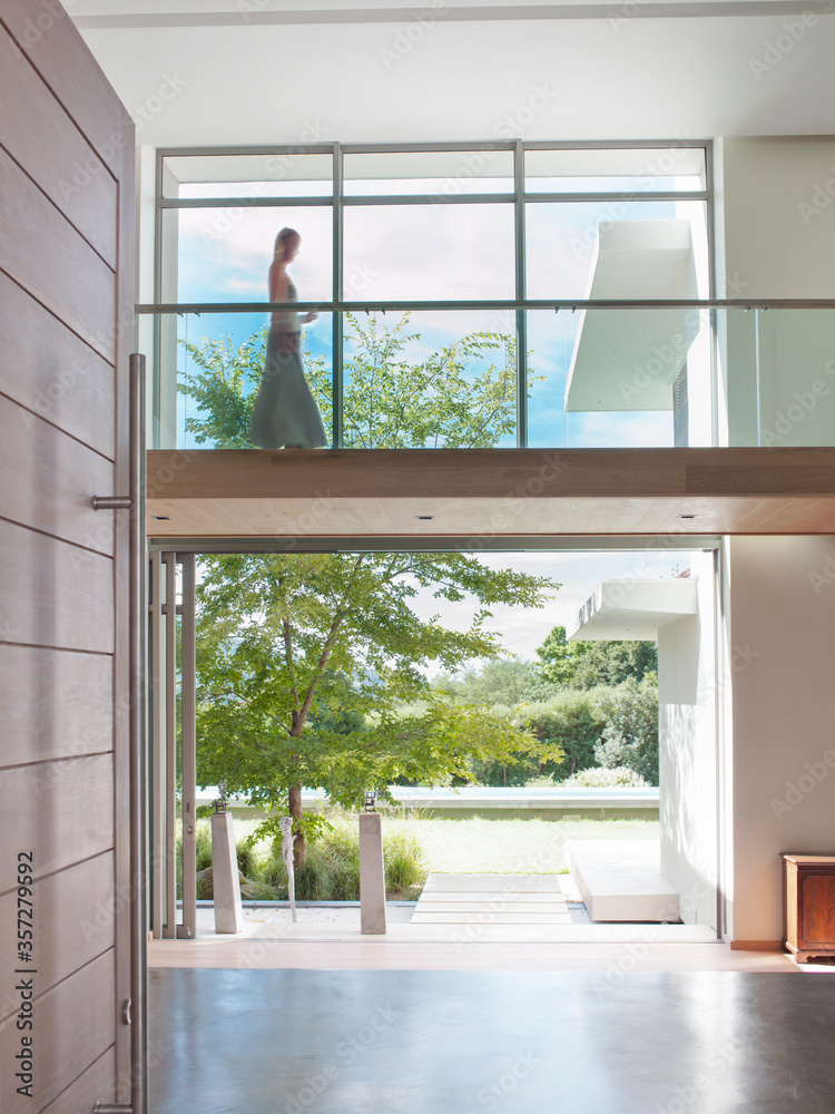 Fototapeta premium Woman on modern elevated walkway