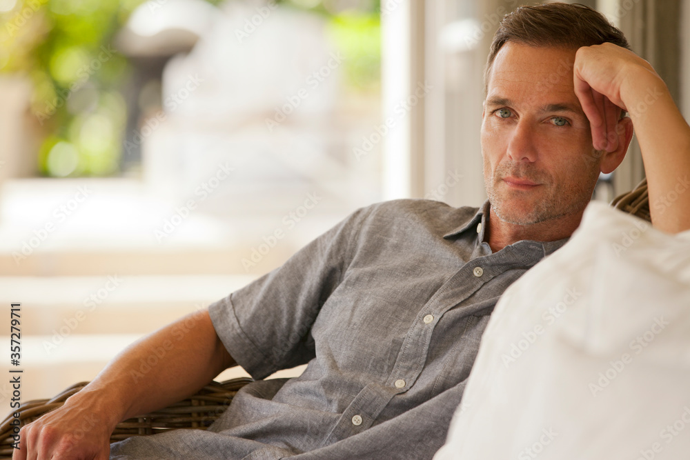 Portrait of serious man on porch