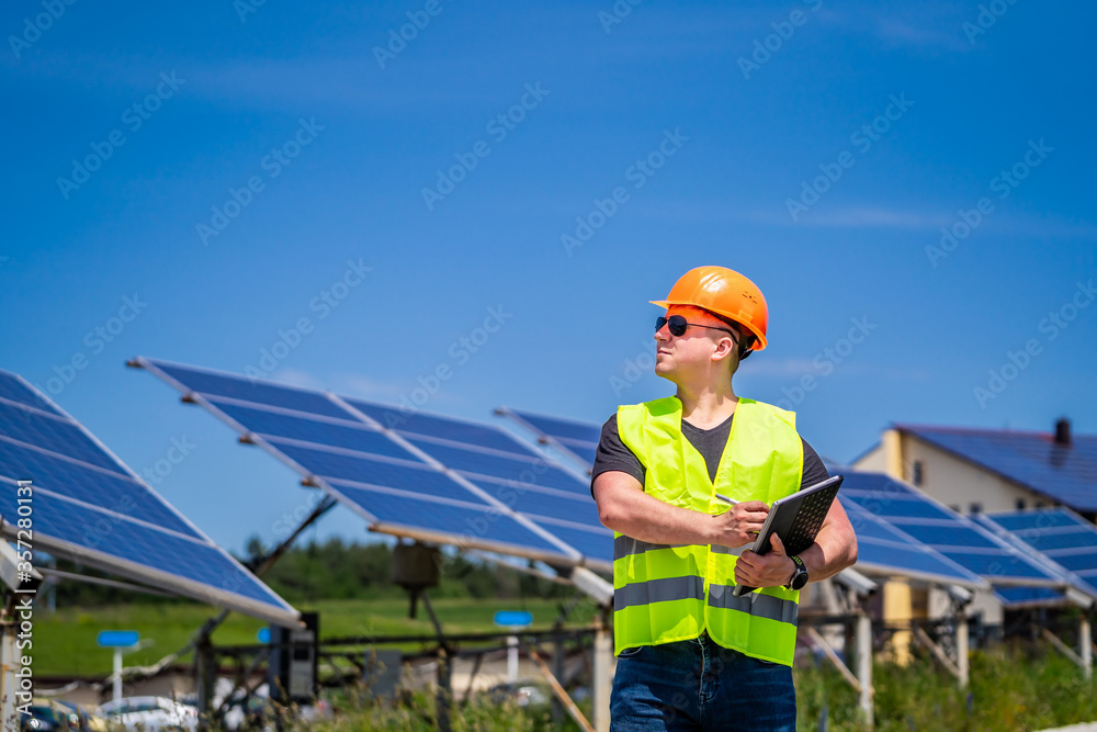 Green energy worker is conducting on-site inspection visit at the new energy base. Green energy worker is conducting on-site inspection visit at the new energy base.