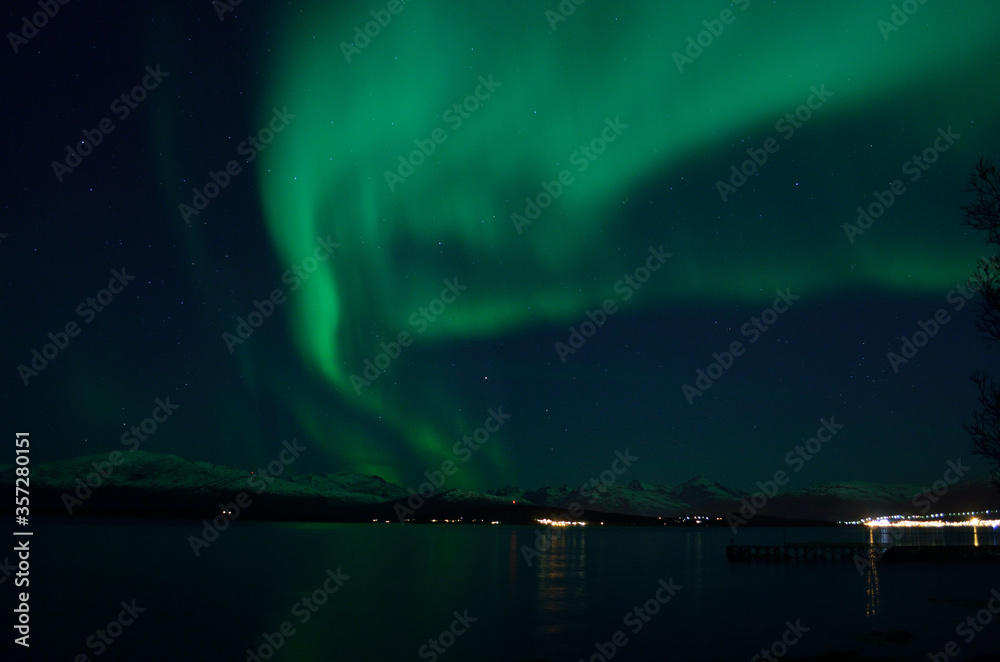 beautiful aurora borealis over fjord landscape