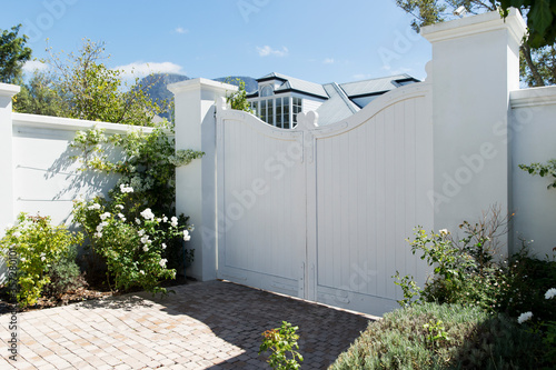 Fototapeta White gate outside luxury house