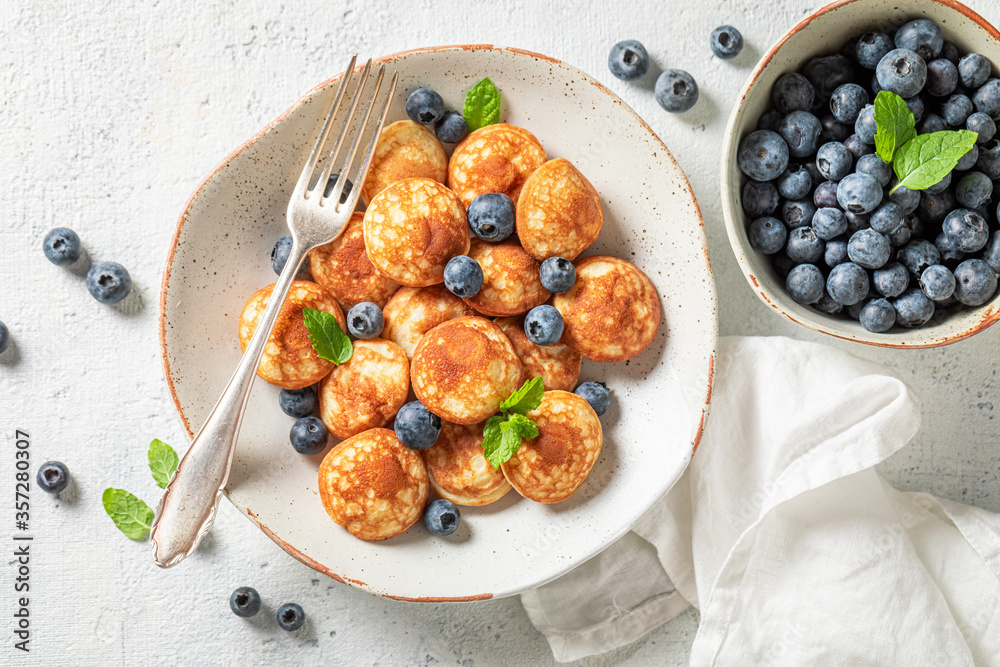 Delicious poffertjes for sweet and tasty breakfast Delicious poffertjes for sweet and tasty breakfast