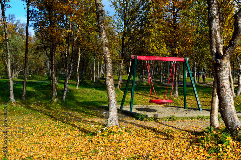 vibrant autumn forest with playground swing set and hiking trails vibrant autumn forest with playground swing set and hiking trails
