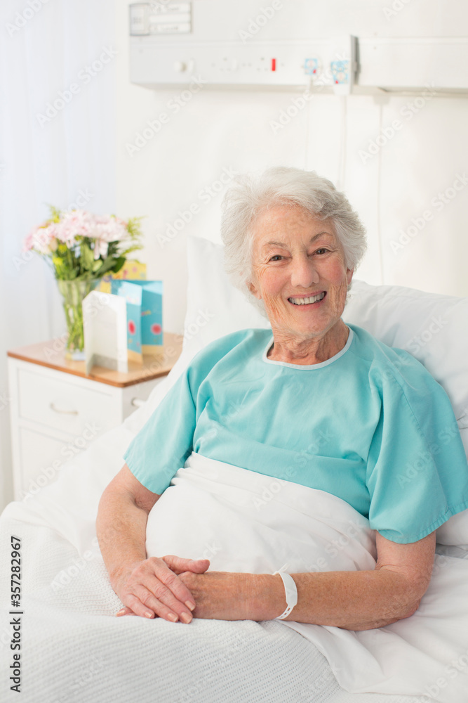 Portrait of smiling aging patient in hospital bed Portrait of smiling aging patient in hospital bed