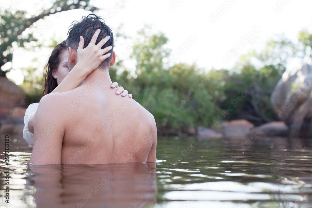 Couple hugging in lake Couple hugging in lake