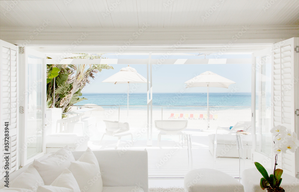Modern living room overlooking beach and ocean