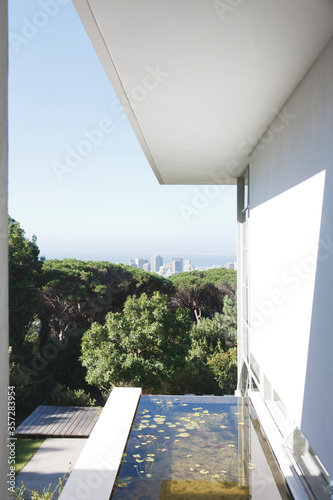 Modern house overlooking city in distance